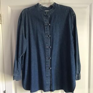 Long sleeved denim shirt with covered buttons.